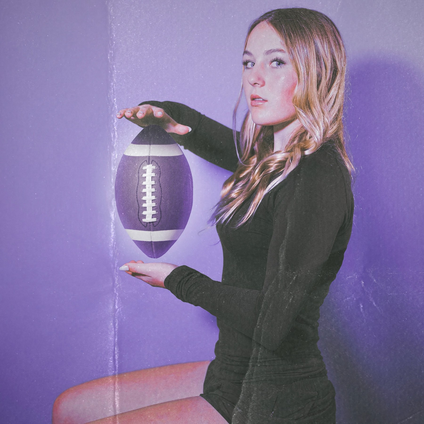 AnnaSofia Dickens posing with a football