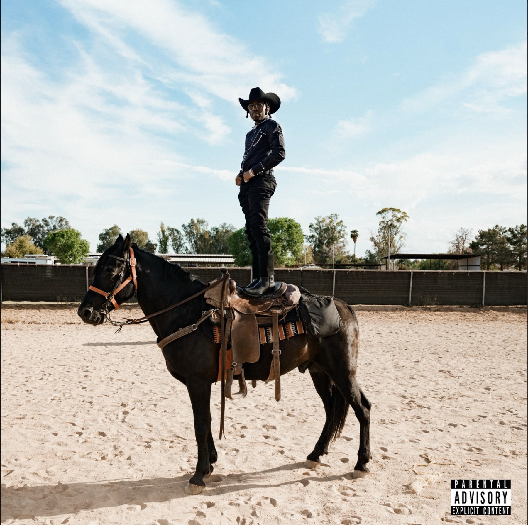CHAZ iLL standing on horseback