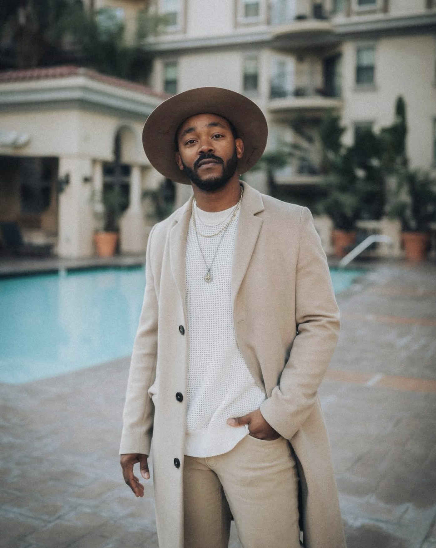 Portrait of Ethan Butler beside a pool